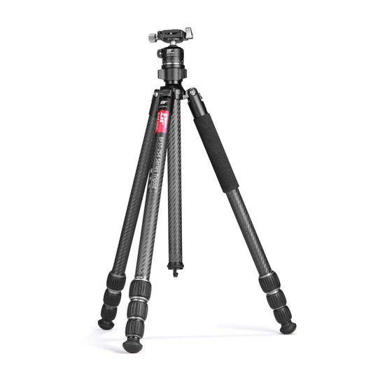 A carbon fiber tripod with black rubberized leg sleeves and a silver head, shown on a clean white background.